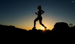 A woman running over a hill