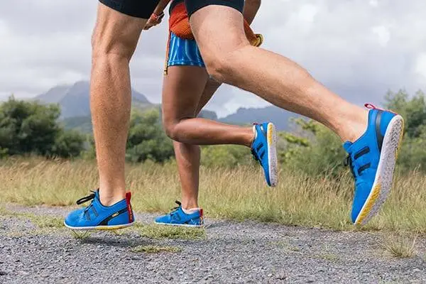 athletes running wearing minimalist shoes