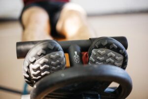 A closeup of an athlete using the tib bar for shin splints