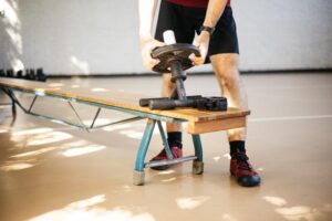 an athlete loading a tib bar