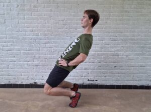 athlete doing a sissy squat as a knees over toes program staple